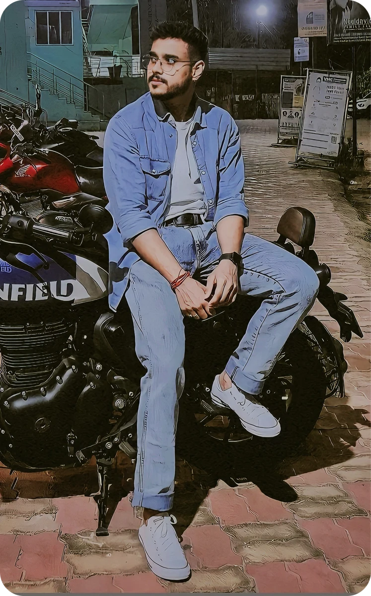 Shouvik sitting beside his car